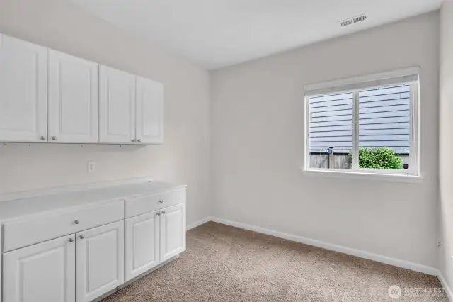 Main floor bonus room. Built-ins stay. Currently used as office.
