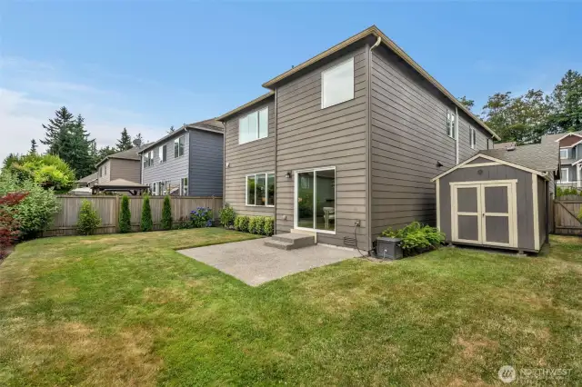 Fully fenced back yard. Convenient storage shed stays.