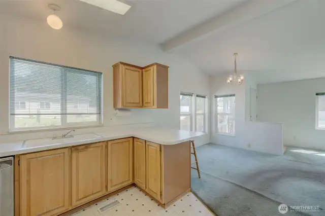 Kitchen with small eating bar (seats 2), looking towards dining area.