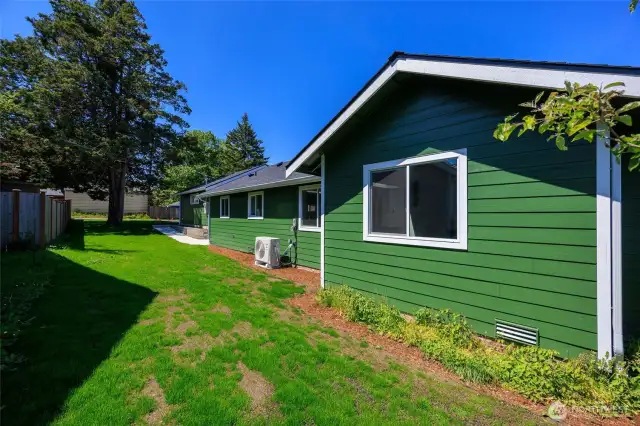 Expansive partially fenced yard.