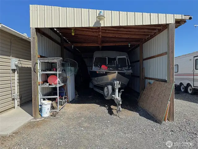 Utility Shelter makes for perfect parking for boat, cars, tractor, play toys