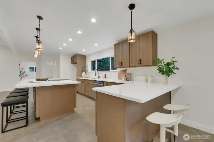 Gorgeous new countertops and cabinetry throughout the kitchen.