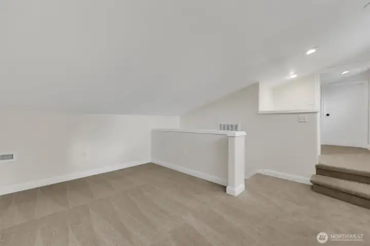 Bonus loft bedroom, perfect for guests, a playroom, or creative space.