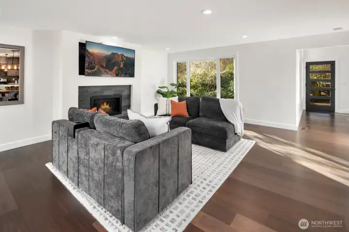 main level living room with gas fireplace