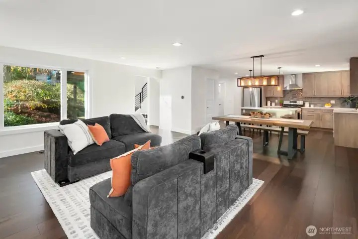 main level living room flowing into the kitchen