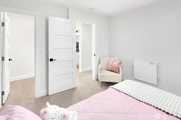 upper level bedroom with walk-in closet