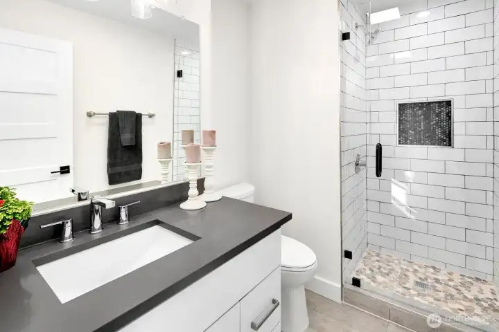 upper level 3/4 bathroom off hallway