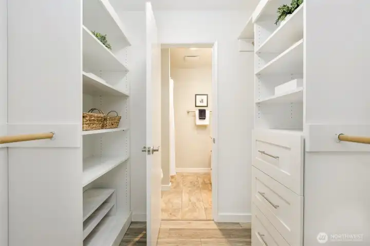The well thought out build-ins in the walk-in closet provide ample storage  and keep everything super organized.