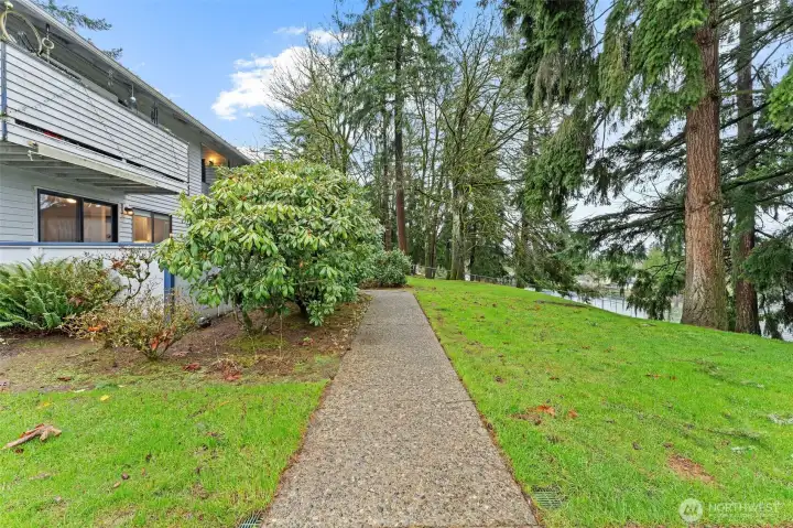 Peaceful, park-like grounds surround the community with mature evergreens, open green space, and well-maintained walking paths. A serene setting that offers a true sense of privacy.