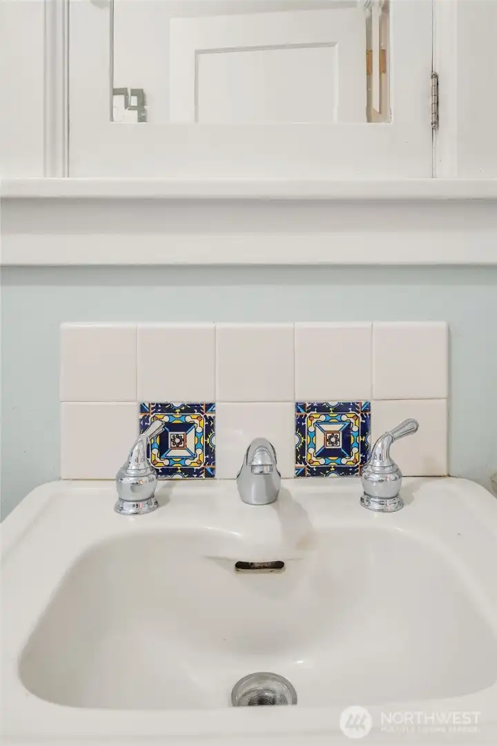 Ornate tilework is also featured above the kitchen sink.