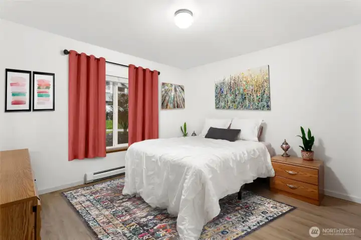 Good sized bedroom with big windows and updated flooring.