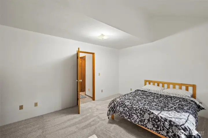 Downstairs bed located near bath for guests or multi-gen.