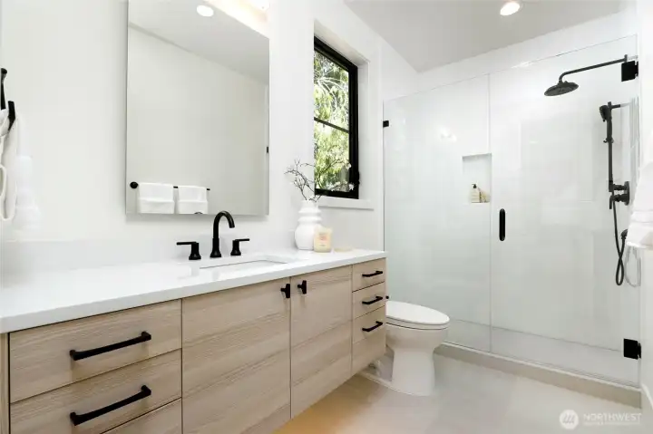 Primary Suite Bath with Floating Cabinet, Sensor Lighting and Luxury Seamless Glass Shower with Hand Held and Built-In Shelf Primary Suite Bath with Floating Cabinet, Sensor Lighting and Luxury Seamless Glass Shower with Hand Held and Built-In Shelf