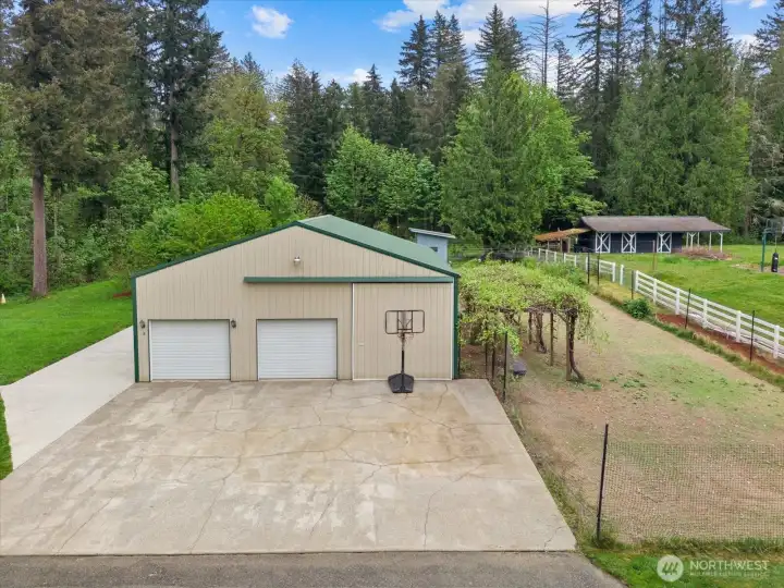 shop with large garden bed and mature grape vines to the side!