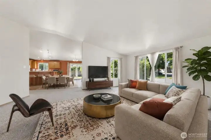 Virtually staged. Open-concept great room flows seamlessly from the living area into the kitchen and dining space — perfect for everyday living and hosting.