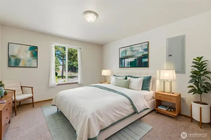 Virtually staged. Third bedroom with large window, abundant natural light, and easy access to the hall bath — ideal as a guest room or home office.