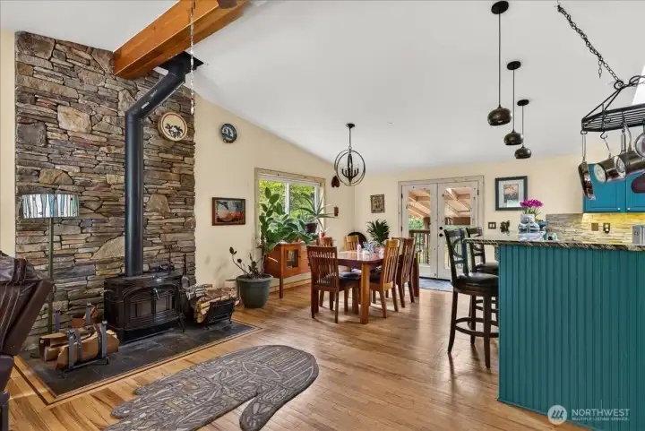 Dining space that is open to the kitchen, bar stool seating avail at kitchen counter.