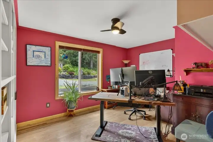 Spacious bonus room that is currently being used as a home office. With a wall of builtin's which a great way to stay organized.