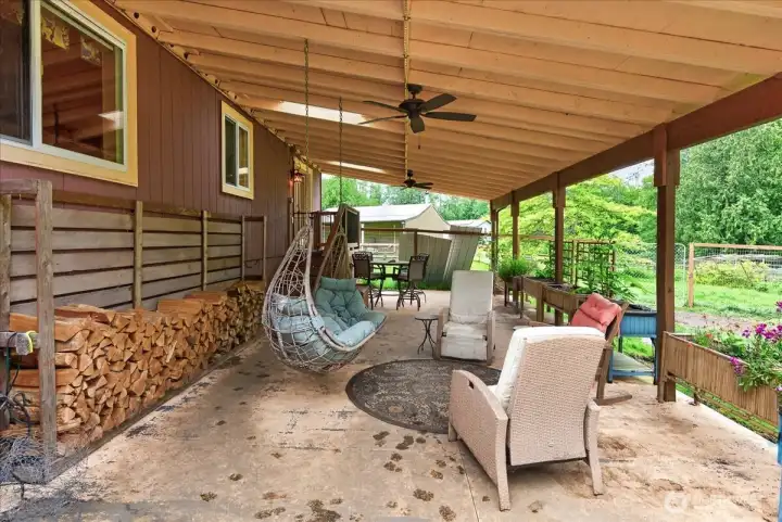 Patio off back of home that is spacious for entertaining or enjoying the peaceful setting around you.