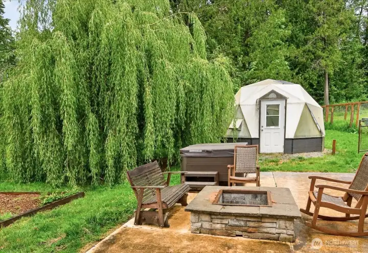 Geodesic greenhouse right off the back patio and next to the designated garden space. Enjoy the salt water hottub (with ozone options) & firepit - excellent space for entertaining!