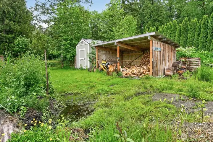 Lean-to which is a great space to store lawnmower or other outdoor necessities.