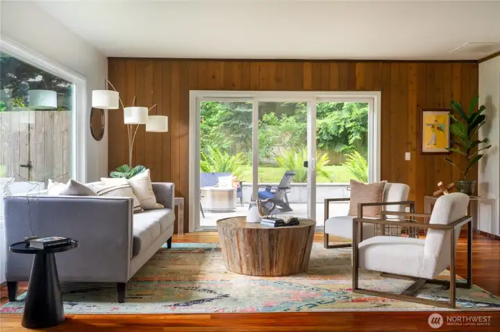 The light and bright living room opens to a large patio