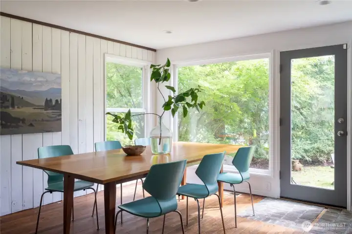 Dining area off of the kitchen with large windows