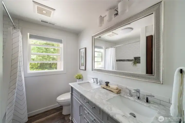 Second upstairs bathroom remodeled with double sink and bathtub