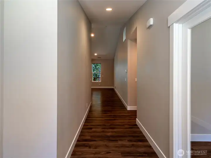 Front entry hallway office/den to the right and bedroom on left. Front entry hallway office/den to the right and bedroom on left.