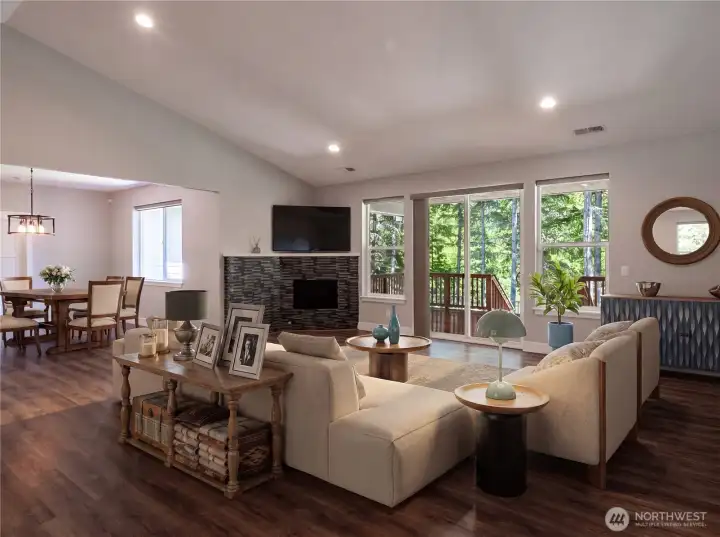 Spacious living room with vaulted ceilings. Staged photo. Spacious living room with vaulted ceilings. Staged photo.