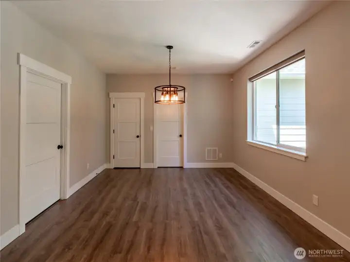 Dining room with Laundry room on the left & 2nd master bedroom straight ahead. Dining room with Laundry room on the left & 2nd master bedroom straight ahead.