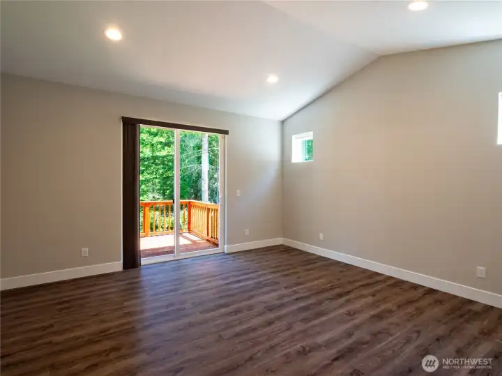 Master bedroom with vaulted ceilings & private deck. Master bedroom with vaulted ceilings & private deck.