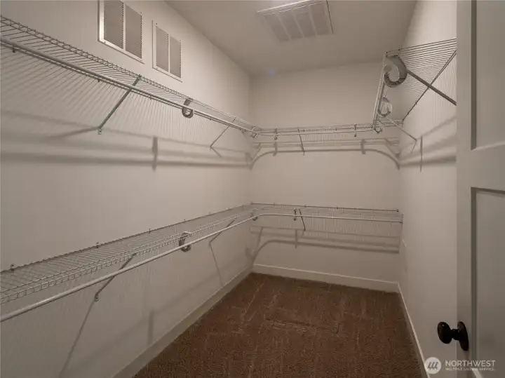 Master bedroom walk-in closet. Master bedroom walk-in closet.