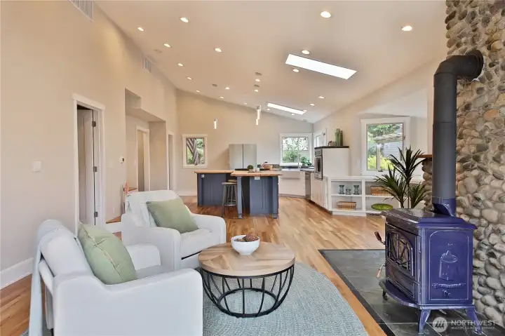 Open floor plan with wood burning fireplace for cozy nights.