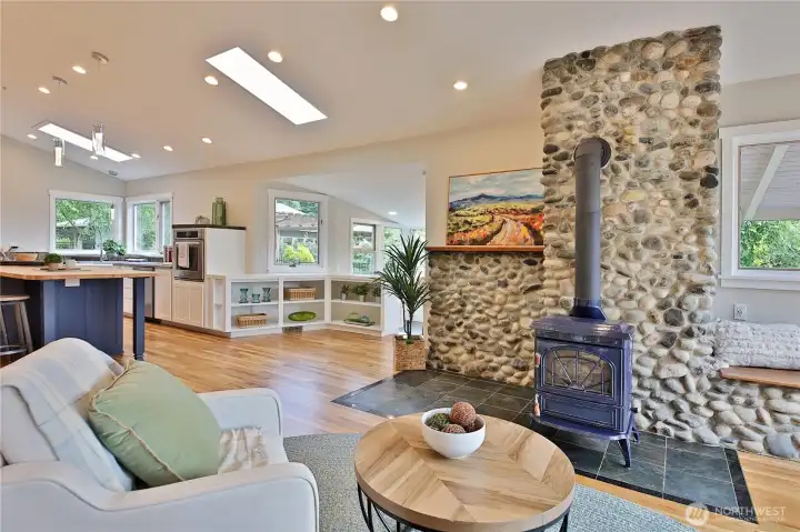 River rock fireplace surround sets the mood for comfortable living.