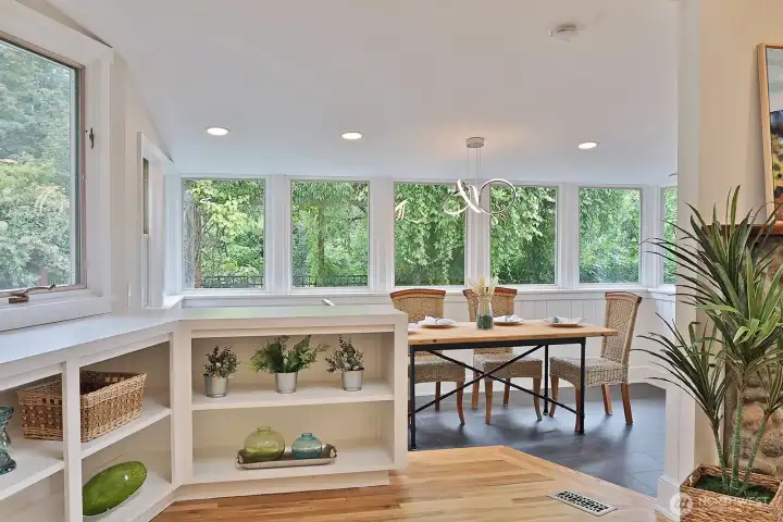 Light and bright dining room overlooks courtyard with fountain.