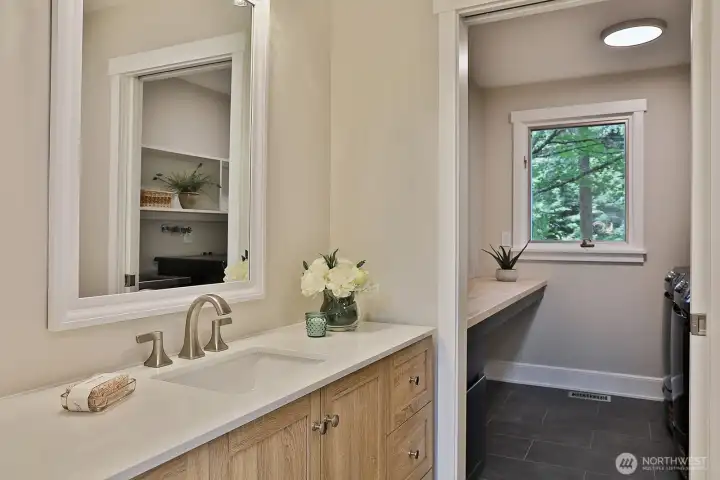 Main level half bath links to laundry room.
