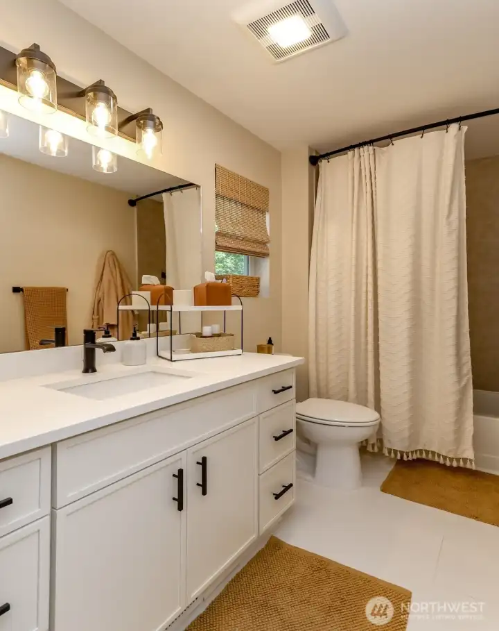 Upper level updated full bath in hallway Upper level updated full bath in hallway