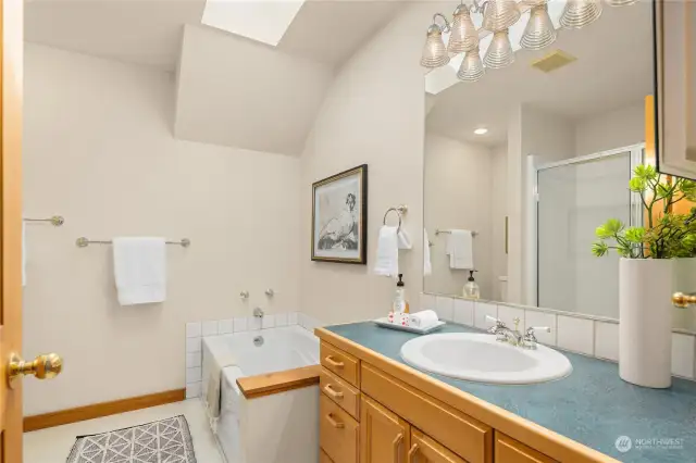 The attached primary bath has a large soaking tub and walk in shower.