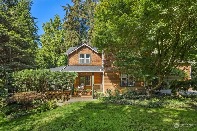 Mature gardens surround this home.