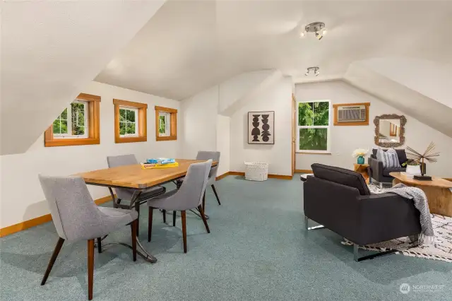 A very large bonus room above the garage can have many uses. The sellers used this space as a yoga studio as it has access from inside the home as well as a private stair case accessed from the interior of the garage.