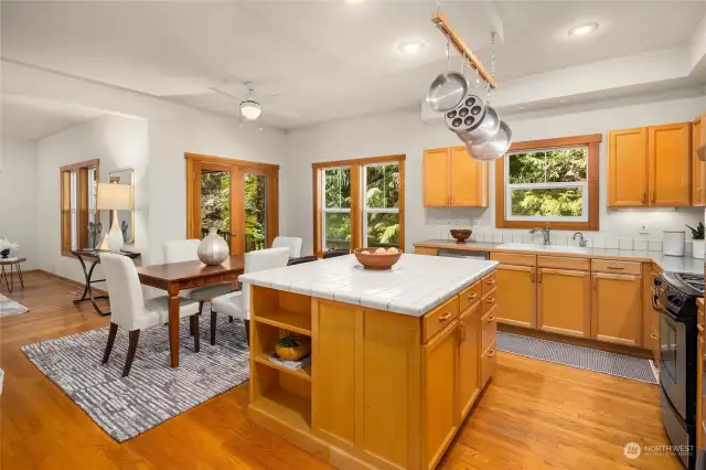 The dining area is adjacent to the kitchen and also to the double glass doors leading to the large deck. Enjoy dining in, or out with nature!