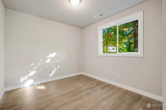 One of the bedrooms is conveniently located on the main floor, making it the perfect space for a mother-in-law suite, guest room, home office, or for multi-generational living.