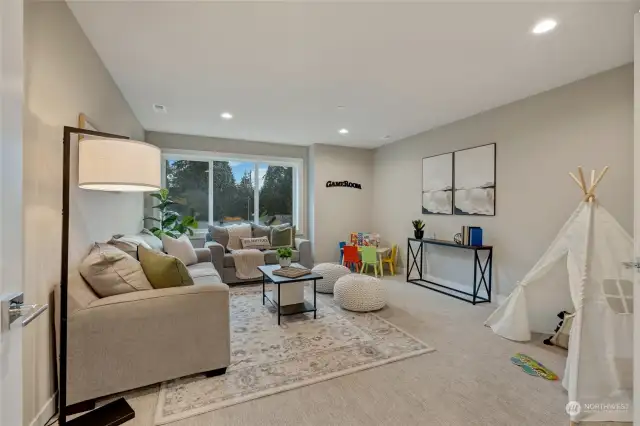 Upstairs, you’ll discover an enormous family room/bonus room, offering endless possibilities. Whether you envision this space as a state-of-the-art home theater, a game room, or a cozy retreat for relaxation, this room can easily adapt to your lifestyle. The options are truly limitless.