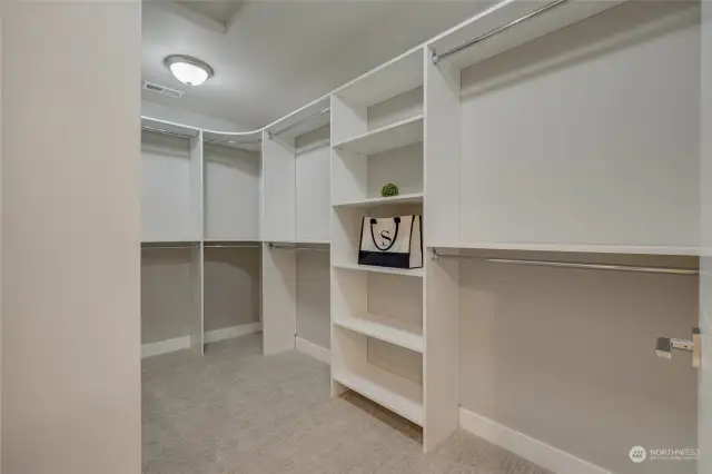 The centerpiece of the suite is the massive  walk-in closet, offering ample space to  organize and display your wardrobe and  accessories.