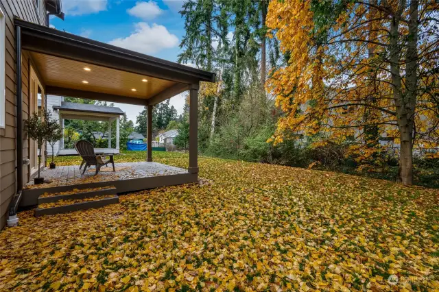 Step outside and enjoy the spacious covered  back deck, perfect for outdoor dining,  relaxation, or simply enjoying the fresh air