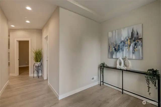 Step inside and be greeted by the bright, open floor plan that’s flooded with natural light from large, beautifully crafted windows, creating a warm and inviting atmosphere throughout.