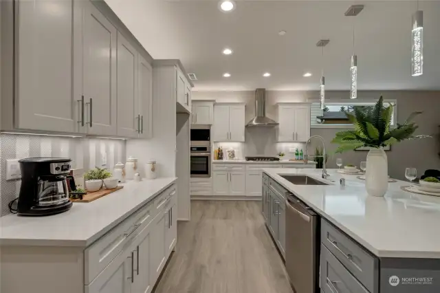 The large kitchen island serves as the perfect gathering spot for casual meals or hosting family and friends.