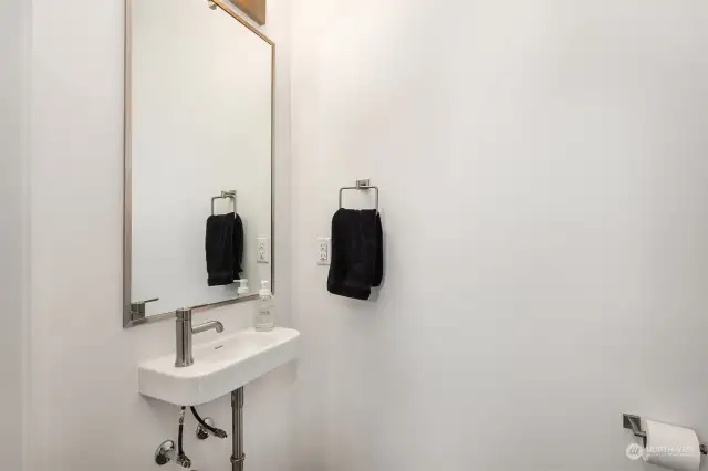 Stylish vanity mirror adding elegance and depth.