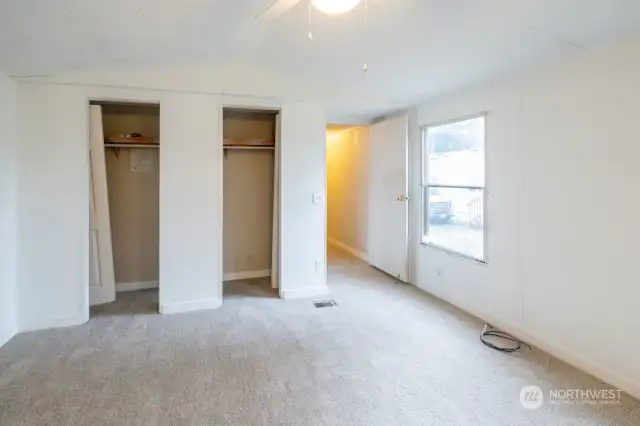 Double closet in the primary bedroom. New carpeting.